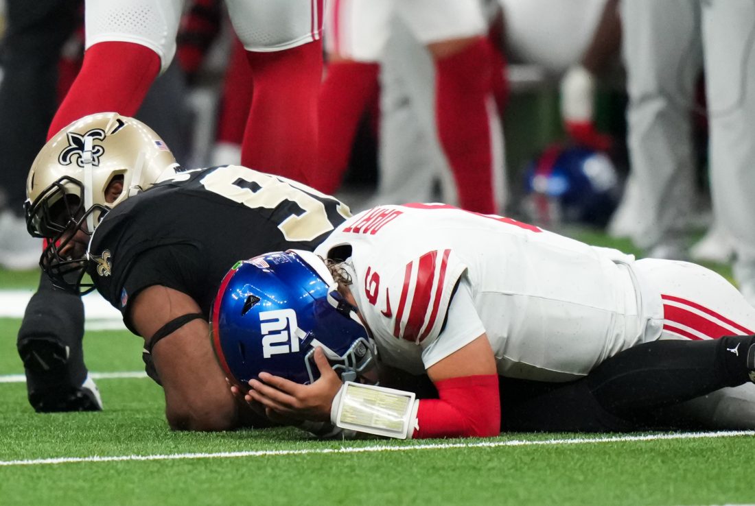 Oct 5, 2025; New Orleans, Louisiana, USA; New York Giants quarterback Jaxson Dart (6) reacts after fumbling the ball against the New Orleans Saints during the third quarter at Caesars Superdome. Mandatory Credit: Matthew Hinton-Imagn Images