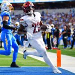 Oct 5, 2025; Inglewood, California, USA; Washington Commanders running back Jacory Croskey-Merritt (22) runs for a touchdown against the Los Angeles Chargers in the second half at SoFi Stadium. Mandatory Credit: Gary A. Vasquez-Imagn Images