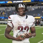 Oct 5, 2025; Inglewood, California, USA; Washington Commanders running back Jacory Croskey-Merritt (22) is interviewed after the game against the Los Angeles Chargers at SoFi Stadium.