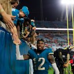 Jacksonville Jaguars wide receiver Travis Hunter (12) high-fives fans after the game of an NFL football matchup at EverBank Stadium, Monday, Oct. 6, 2025, in Jacksonville, Fla. The Jacksonville Jaguars edged the Kansas City Chiefs 31-28.