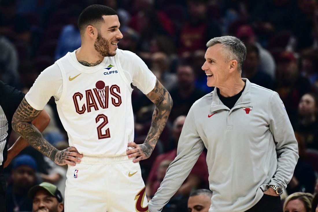 Oct 7, 2025; Cleveland, Ohio, USA; Cleveland Cavaliers guard Lonzo Ball (2) talks to Chicago Bulls Head Coach Billy Donovan during the first half at Rocket Arena.