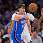 Oct 6, 2025; Fort Worth, Texas, USA; Oklahoma City Thunder guard Brooks Barnhizer (23) moves the ball past Dallas Mavericks forward/center Anthony Davis (3) during the game between the Dallas Mavericks and the Oklahoma City Thunder at Dickie's Arena. Mandatory Credit: Jerome Miron-Imagn Images