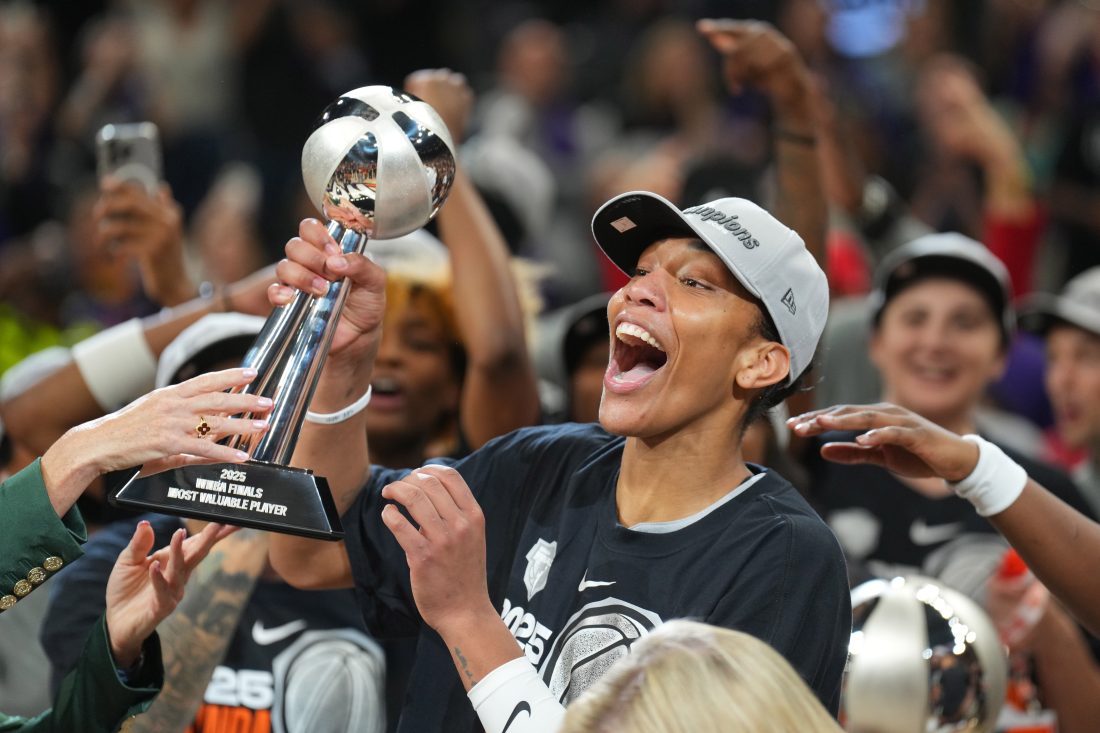 Oct 10, 2025; Phoenix, Arizona, USA; Las Vegas Aces center A'ja Wilson (22) celebrates with teammates after game four of the 2025 WNBA Finals at Mortgage Matchup Center. Mandatory Credit: Joe Camporeale-Imagn Images