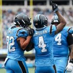 Oct 12, 2025; Charlotte, North Carolina, USA; Carolina Panthers wide receiver Tetairoa McMillan (4) celebrates a touchdown during the second half the Dallas Cowboys at Bank of America Stadium. Mandatory Credit: Cory Knowlton-Imagn Images