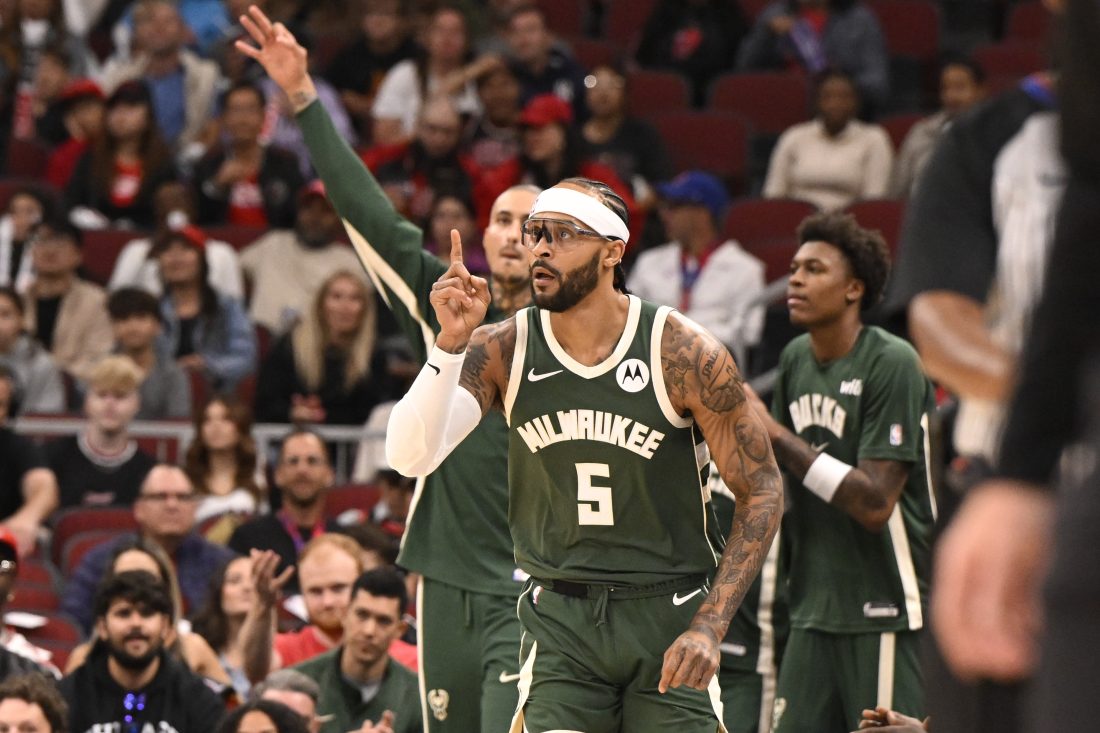 Oct 12, 2025; Chicago, Illinois, USA; Milwaukee Bucks guard Gary Trent Jr. (5) points after scoring against the Chicago Bulls during the first half at the United Center. Mandatory Credit: Matt Marton-Imagn Images