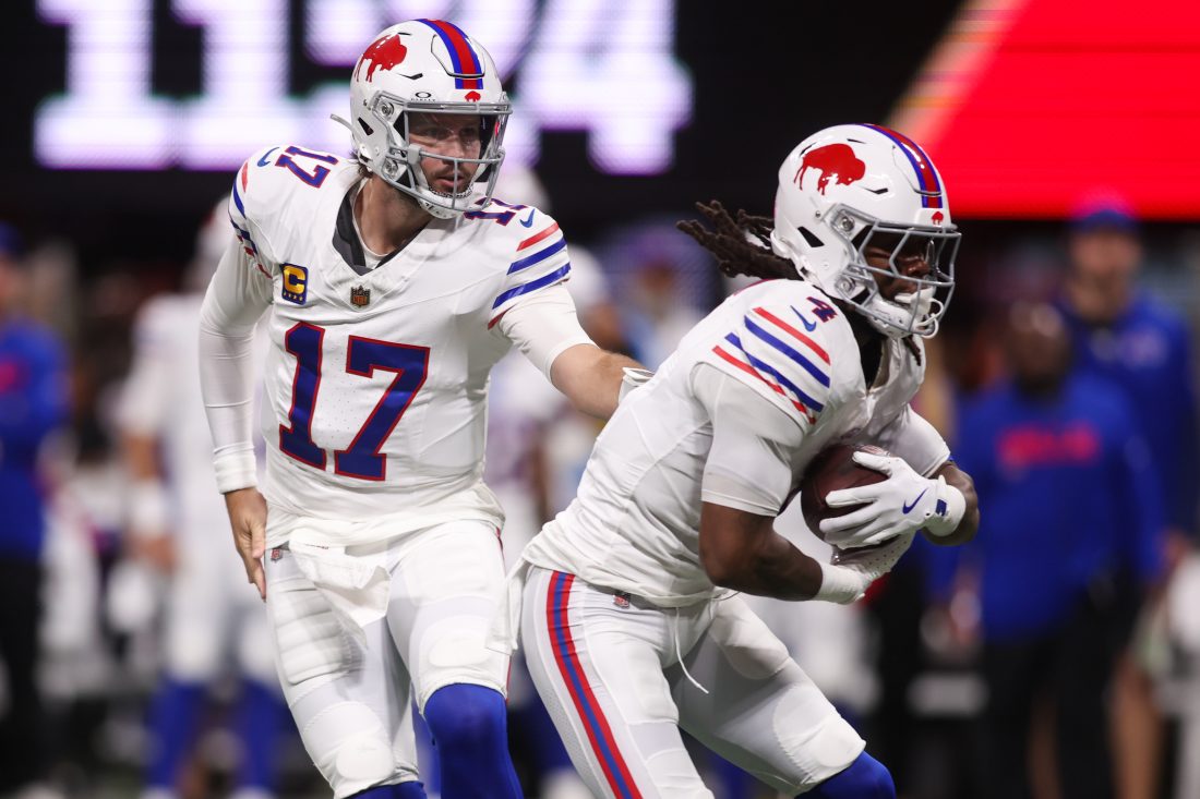 Oct 13, 2025; Atlanta, Georgia, USA; Buffalo Bills quarterback Josh Allen (17) hands off to running back James Cook (4) against the Atlanta Falcons during the first half of a game at Mercedes-Benz Stadium. Mandatory Credit: Brett Davis-Imagn Images
