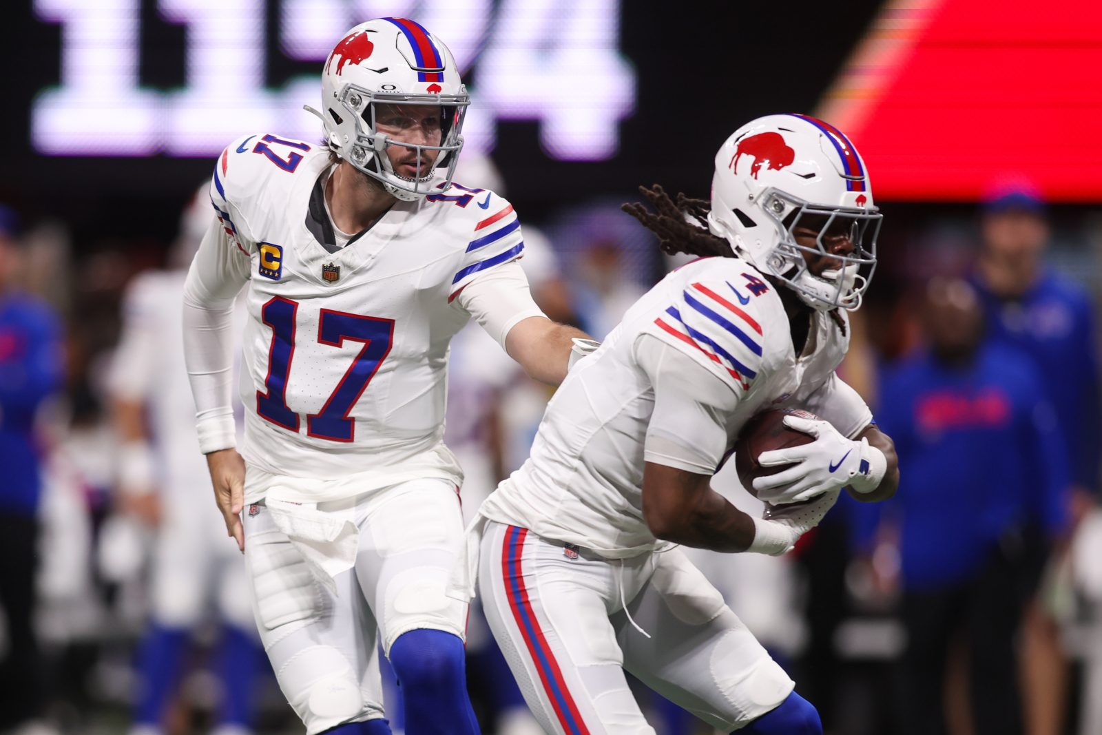 Oct 13, 2025; Atlanta, Georgia, USA; Buffalo Bills quarterback Josh Allen (17) hands off to running back James Cook (4) against the Atlanta Falcons during the first half of a game at Mercedes-Benz Stadium. Mandatory Credit: Brett Davis-Imagn Images