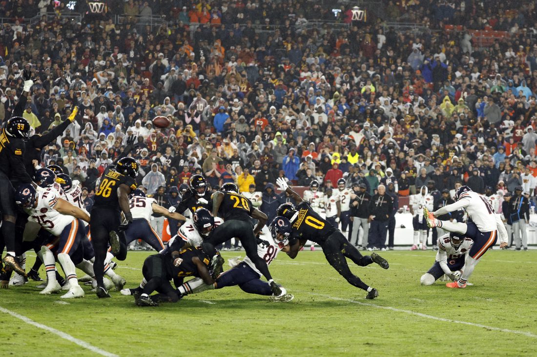 Oct 13, 2025; Landover, Maryland, USA; Chicago Bears kicker Jake Moody (16) kicks a game-winning field goal against the Washington Commanders during the fourth quarter at Northwest Stadium.