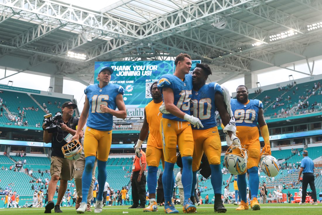 Oct 12, 2025; Miami Gardens, Florida, USA; Los Angeles Chargers wide receiver Ladd McConkey (15) and running back Kimani Vidal (30) celebrate after the game against the Miami Dolphins at Hard Rock Stadium. Mandatory Credit: Sam Navarro-Imagn Images