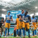 Oct 12, 2025; Miami Gardens, Florida, USA; Los Angeles Chargers wide receiver Ladd McConkey (15) and running back Kimani Vidal (30) celebrate after the game against the Miami Dolphins at Hard Rock Stadium. Mandatory Credit: Sam Navarro-Imagn Images