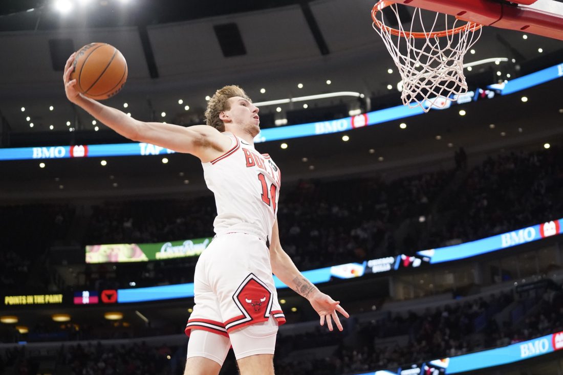Oct 16, 2025; Chicago, Illinois, USA; Chicago Bulls forward Matas Buzelis (14) goes up for a dunk against the Minnesota Timberwolves during the second half at United Center. Mandatory Credit: David Banks-Imagn Images
