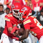 Oct 19, 2025; Kansas City, Missouri, USA; Kansas City Chiefs quarterback Gardner Minshew (17) hands teh ball to running back Brashard Smith (24) against the Las Vegas Raiders during the fourth quarter of the game at GEHA Field at Arrowhead Stadium. Mandatory Credit: Denny Medley-Imagn Images