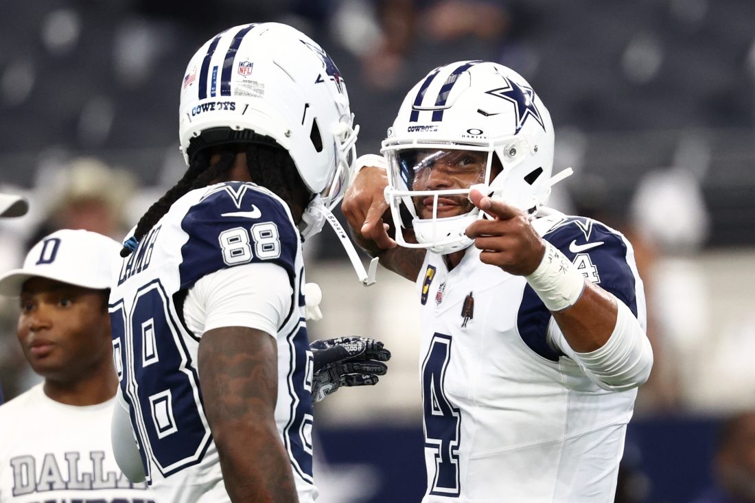 Oct 19, 2025; Arlington, Texas, USA; Dallas Cowboys quarterback Dak Prescott (4) speaks with wide receiver Ceedee Lamb (88) during warmups prior to the game against the Washington Commanders at AT&T Stadium. Mandatory Credit: Kevin Jairaj-Imagn Images