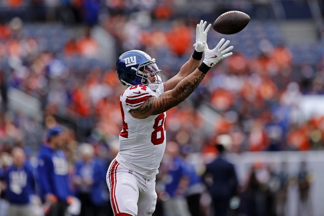 Oct 19, 2025; Denver, Colorado, USA; New York Giants tight end Theo Johnson (84) warms up before the game against the Denver Broncos at Empower Field at Mile High.