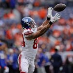 Oct 19, 2025; Denver, Colorado, USA; New York Giants tight end Theo Johnson (84) warms up before the game against the Denver Broncos at Empower Field at Mile High.