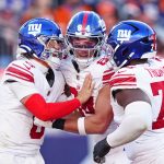 Oct 19, 2025; Denver, Colorado, USA; New York Giants quarterback Jaxson Dart (6), New York Giants tight end Theo Johnson (84) and New York Giants offensive tackle Andrew Thomas (78) react after a play during the second half against the Denver Broncos at Empower Field at Mile High.