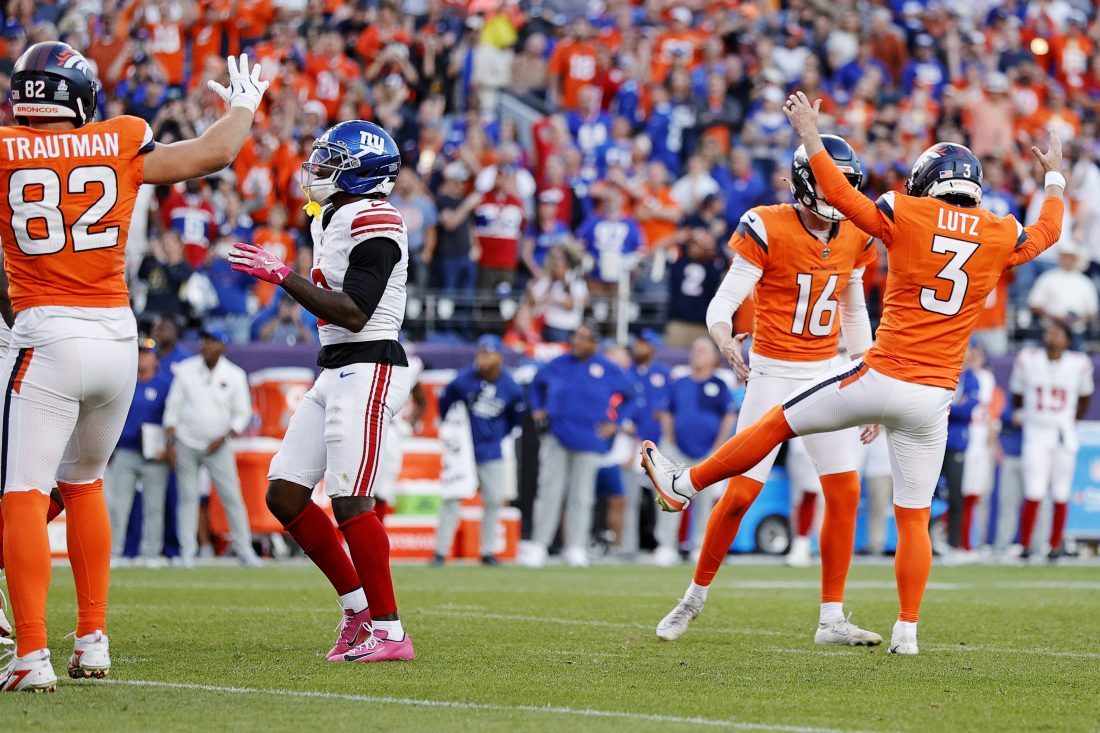 Oct 19, 2025; Denver, Colorado, USA; Denver Broncos punter Jeremy Crawshaw (16) and Denver Broncos kicker Wil Lutz (3) celebrate the win against the New York Giants at Empower Field at Mile High. Mandatory Credit: Isaiah J. Downing-Imagn Images