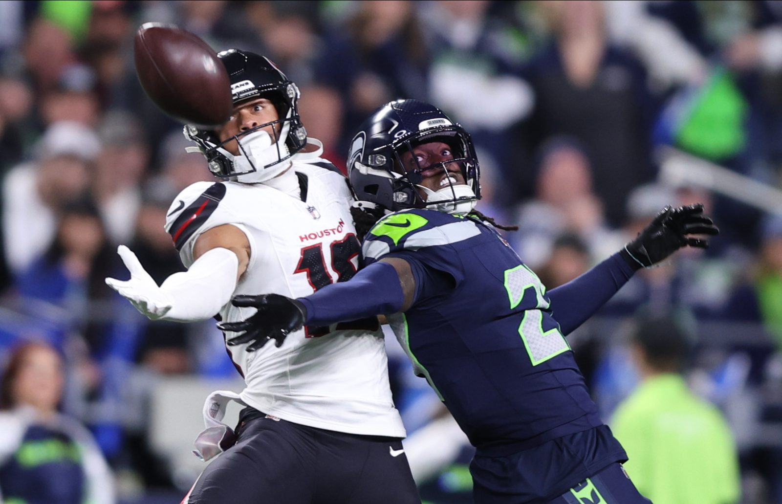 Oct 20, 2025; Seattle, Washington, USA; Seattle Seahawks cornerback Riq Woolen (27) defends a pass intended for Houston Texans wide receiver Xavier Hutchinson (19) during the fourth quarter at Lumen Field.