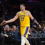 Oct 24, 2025; Los Angeles, California, USA; Los Angeles Lakers guard Luka Doncic (77) returns to the be3nch in the fourth quarteragainst the Minnesota Timberwolves at Crypto.com Arena. Mandatory Credit: Kirby Lee-Imagn Images