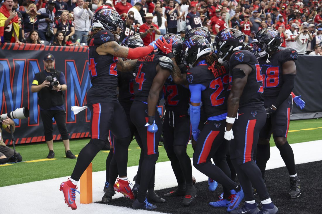 Oct 26, 2025; Houston, Texas, USA; Houston Texans cornerback Kamari Lassiter (4) celebrates with teammates after intercepting a pass during the fourth quarter against the San Francisco 49ers at NRG Stadium. Mandatory Credit: Troy Taormina-Imagn Images