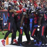 Oct 26, 2025; Houston, Texas, USA; Houston Texans cornerback Kamari Lassiter (4) celebrates with teammates after intercepting a pass during the fourth quarter against the San Francisco 49ers at NRG Stadium. Mandatory Credit: Troy Taormina-Imagn Images