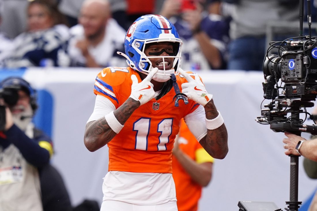 Oct 26, 2025; Denver, Colorado, USA; Denver Broncos wide receiver Troy Franklin (11) celebrates after scoring a touchdown against the Dallas Cowboys in the fourth quarter at Empower Field at Mile High. Mandatory Credit: Ron Chenoy-Imagn Images