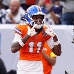 Oct 26, 2025; Denver, Colorado, USA; Denver Broncos wide receiver Troy Franklin (11) celebrates after scoring a touchdown against the Dallas Cowboys in the fourth quarter at Empower Field at Mile High. Mandatory Credit: Ron Chenoy-Imagn Images