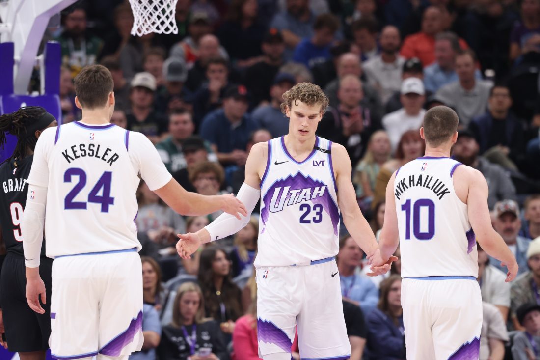 Oct 29, 2025; Salt Lake City, Utah, USA; Utah Jazz forward Lauri Markkanen (23) interacts with center Walker Kessler (24) and guard Svi Mykhailiuk (10) after a basket against the Portland Trail Blazers during the second quarter at Delta Center. Mandatory Credit: Rob Gray-Imagn Images