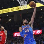 Nov 2, 2025; Oklahoma City, Oklahoma, USA; Oklahoma City Thunder guard Ajay Mitchell (25) goes to the basket beside New Orleans Pelicans guard Jordan Poole (3) during the second quarter at Paycom Center. Mandatory Credit: Alonzo Adams-Imagn Images