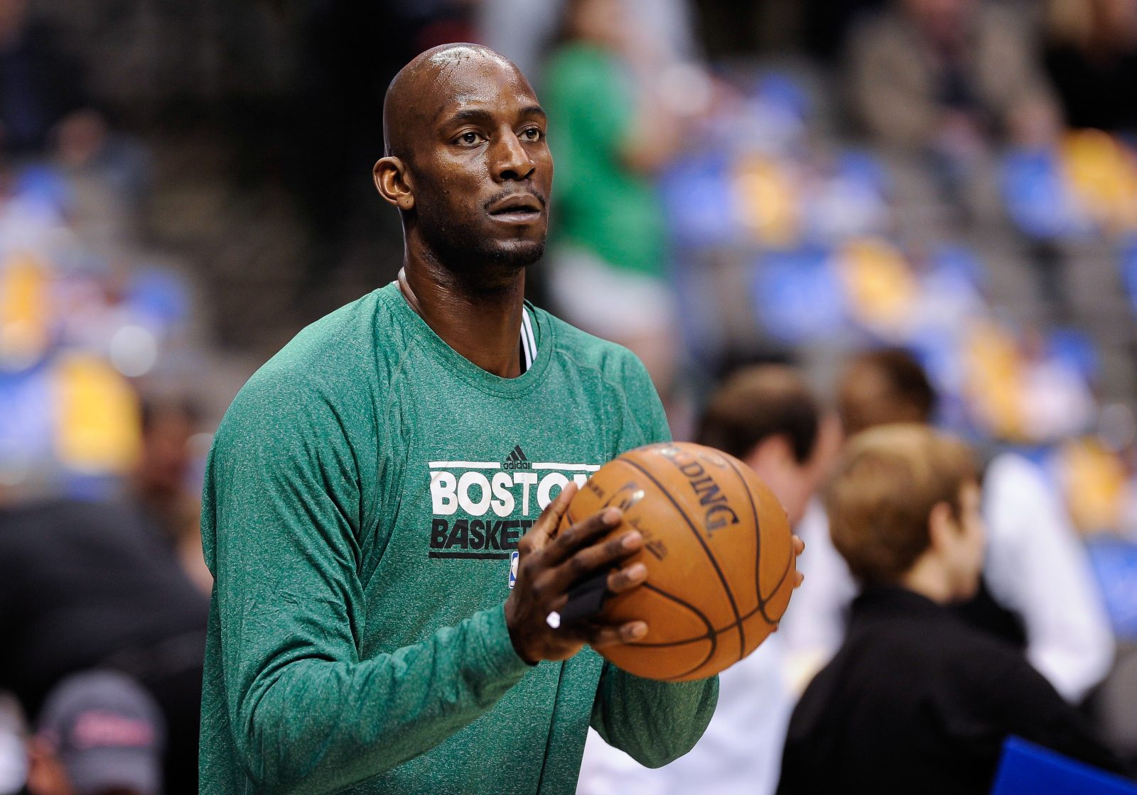 Mar 22, 2013; Dallas, TX, USA; Boston Celtics center Kevin Garnett (5) warms up before the game against the Dallas Mavericks at the American Airlines Center. The Mavericks defeated the Celtics 104-94.