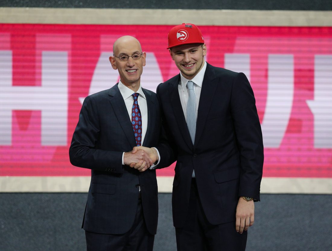 Jun 21, 2018; Brooklyn, NY, USA; Luka Doncic greets NBA commissioner Adam Silver after being selected as the number three overall pick to the Atlanta Hawks in the first round of the 2018 NBA Draft at the Barclays Center.