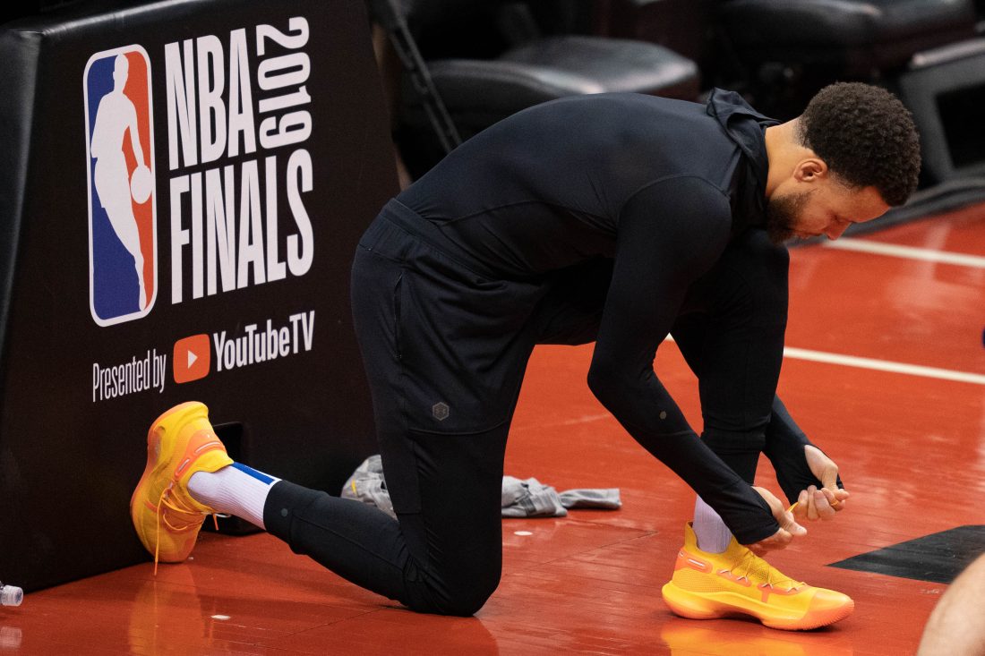 May 29, 2019; Toronto, Ontario, CAN; Golden State Warriors guard Stephen Curry (30) ties his Under Armour shoe during media day for the 2019 NBA Finals at Scotiabank Arena. Mandatory Credit: Kyle Terada-USA TODAY Sports