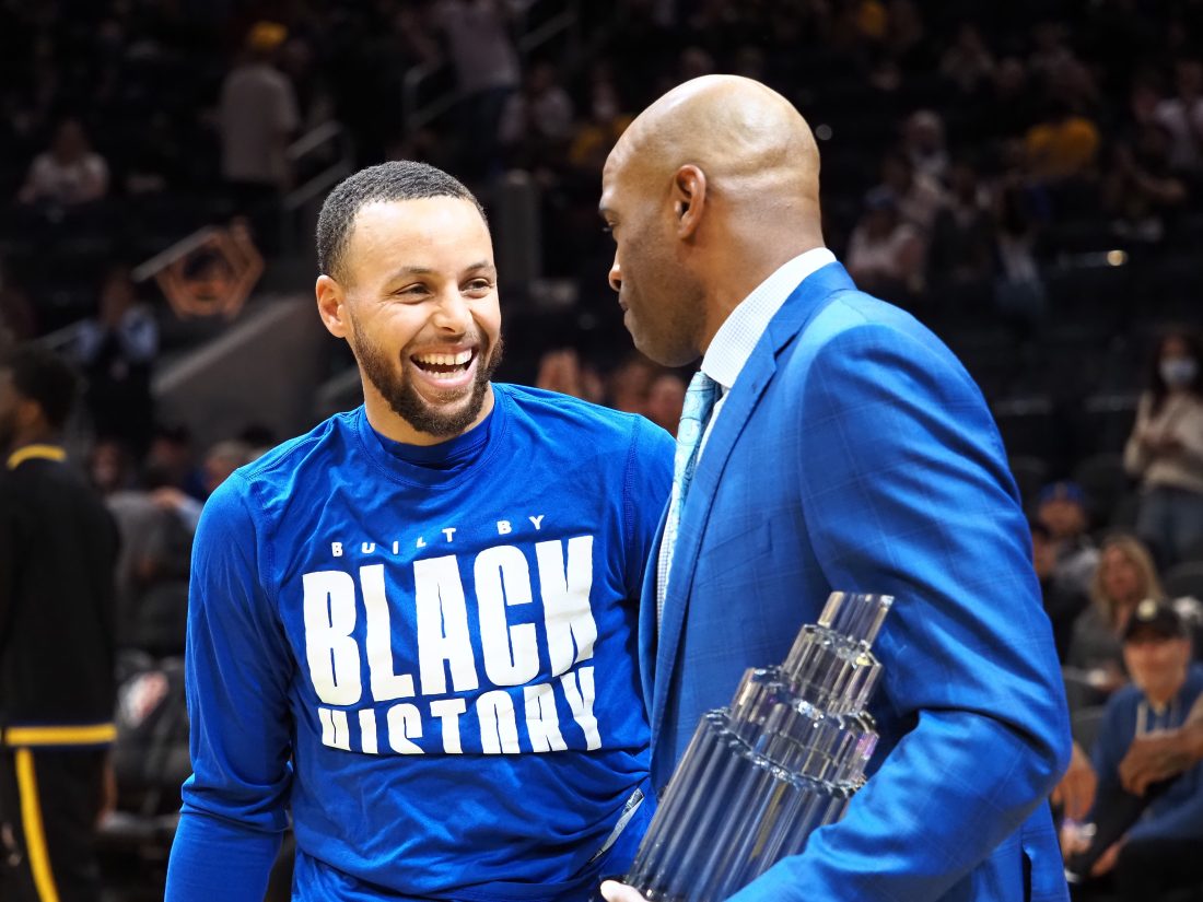 Feb 27, 2022; San Francisco, California, USA; Golden State Warriors guard Stephen Curry (30) receives the All Star MVP trophy from Vince Carter before the game against the Dallas Mavericks at Chase Center. Mandatory Credit: Kelley L Cox-USA TODAY Sports