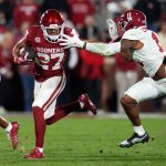 Oklahoma Sooners running back Gavin Sawchuk (27) tries to get away from Alabama Crimson Tide linebacker Jihaad Campbell (11) during a college football game between the University of Oklahoma Sooners (OU) and the Alabama Crimson Tide at Gaylord Family - Oklahoma Memorial Stadium in Norman, Okla., Saturday, Nov. 23, 2024. Oklahoma won 24-3.