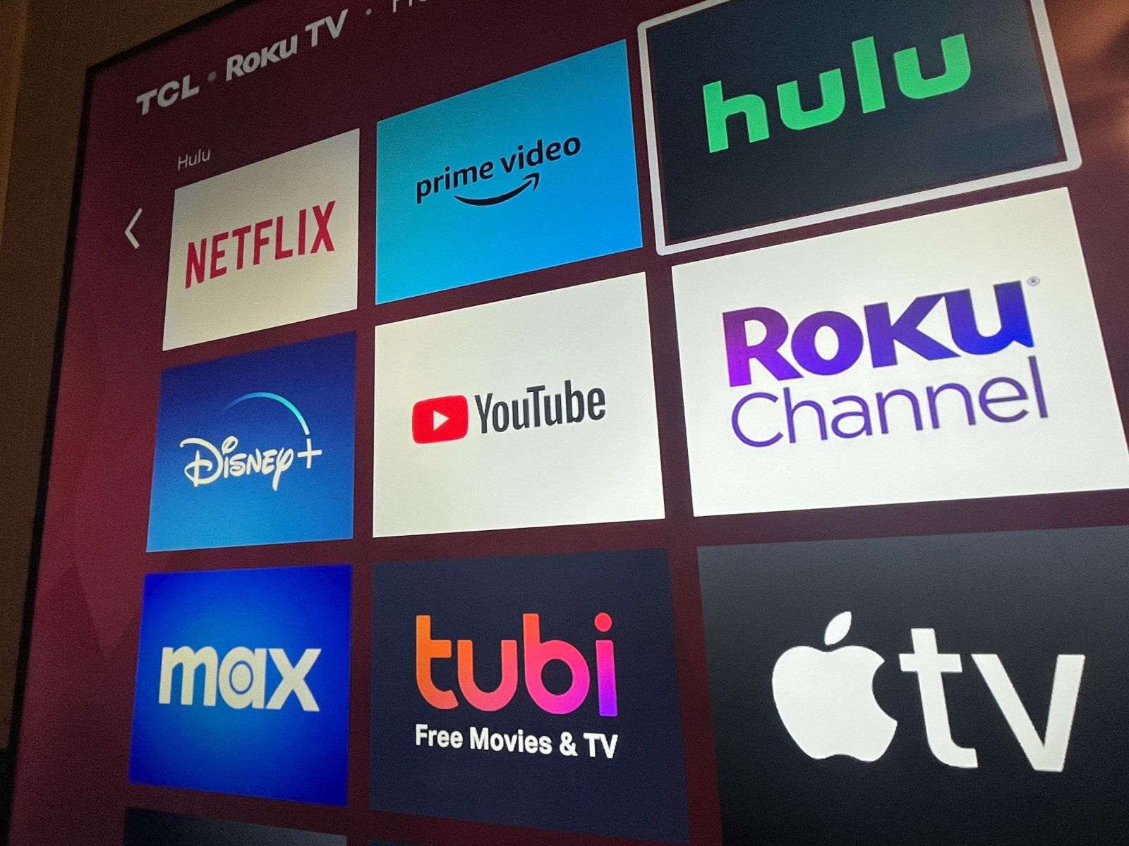 Multiple streaming services appear on a Roku TV, a layout of the evolution of online entertainment.