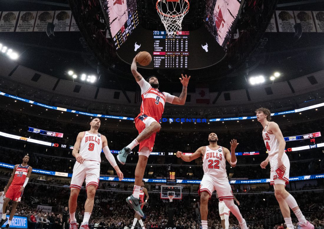 Apr 11, 2025; Chicago, Illinois, USA; Washington Wizards forward Justin Champagnie (9) goes up for a shot against the Chicago Bulls during the first quarter at United Center.