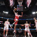 Apr 11, 2025; Chicago, Illinois, USA; Washington Wizards forward Justin Champagnie (9) goes up for a shot against the Chicago Bulls during the first quarter at United Center.