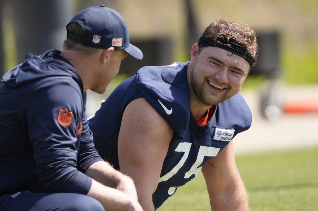May 10, 2025; Lake Forest, IL, USA; Chicago Bears head coach Ben Johnson talks with offensive lineman (75) Ozzy Trapilo during rookie minicamp at Halas Hall. Mandatory Credit: David Banks-Imagn Images
