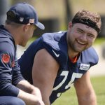 May 10, 2025; Lake Forest, IL, USA; Chicago Bears head coach Ben Johnson talks with offensive lineman (75) Ozzy Trapilo during rookie minicamp at Halas Hall. Mandatory Credit: David Banks-Imagn Images