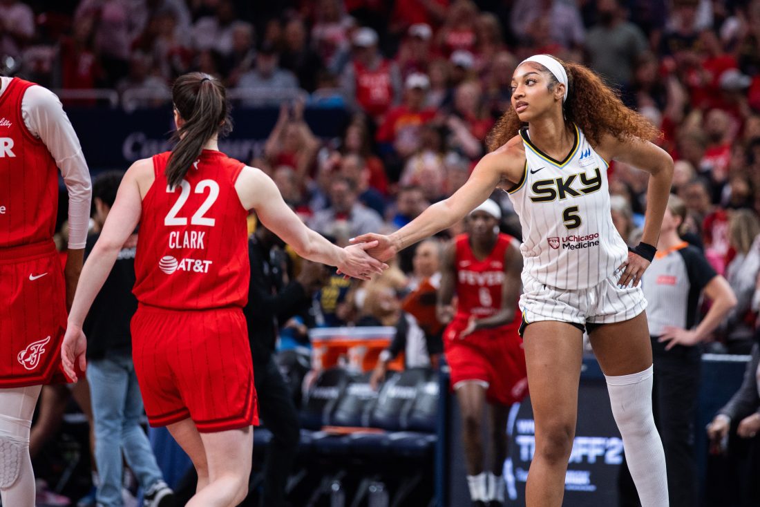 May 17, 2025; Indianapolis, Indiana, USA; Indiana Fever guard Caitlin Clark (22) and Chicago Sky forward Angel Reese (5) shake hands before the game at Gainbridge Fieldhouse.