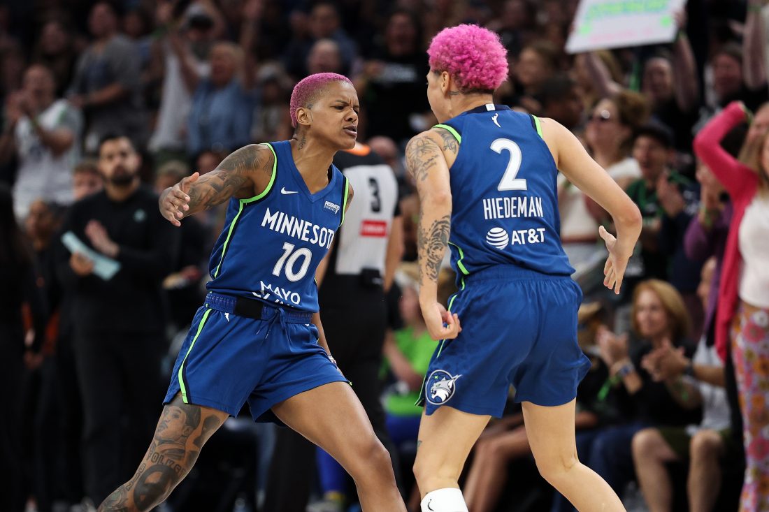 Aug 16, 2025; Minneapolis, Minnesota, USA; Minnesota Lynx guard Courtney Williams (10) celebrates with guard Natisha Hiedeman (2) during the first quarter against the New York Liberty at Target Center.