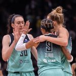Sep 5, 2025; Seattle, Washington, USA; New York Liberty forward Breanna Stewart (30) guard Natasha Cloud (9) and forward Leonie Fiebich (13) celebrate after a game against the Seattle Storm at Climate Pledge Arena.