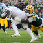 Green Bay Packers linebacker Edgerrin Cooper (56) tackles Detroit Lions running back David Montgomery (5) on Sunday, September 7, 2025, at Lambeau Field in Green Bay, Wis. The Packers defeated the Lions 27-13.