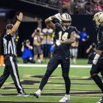 Sep 14, 2025; New Orleans, Louisiana, USA; New Orleans Saints wide receiver Devaughn Vele (14) reacts to scoring a touchdown against San Francisco 49ers safety Jason Pinnock (25) during the second half at Caesars Superdome.
