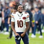 Sep 28, 2025; Paradise, Nevada, USA; Chicago Bears wide receiver Luther Burden III (10) celebrates after the game against the Las Vegas Raiders at Allegiant Stadium. Mandatory Credit: Stephen R. Sylvanie-Imagn Images