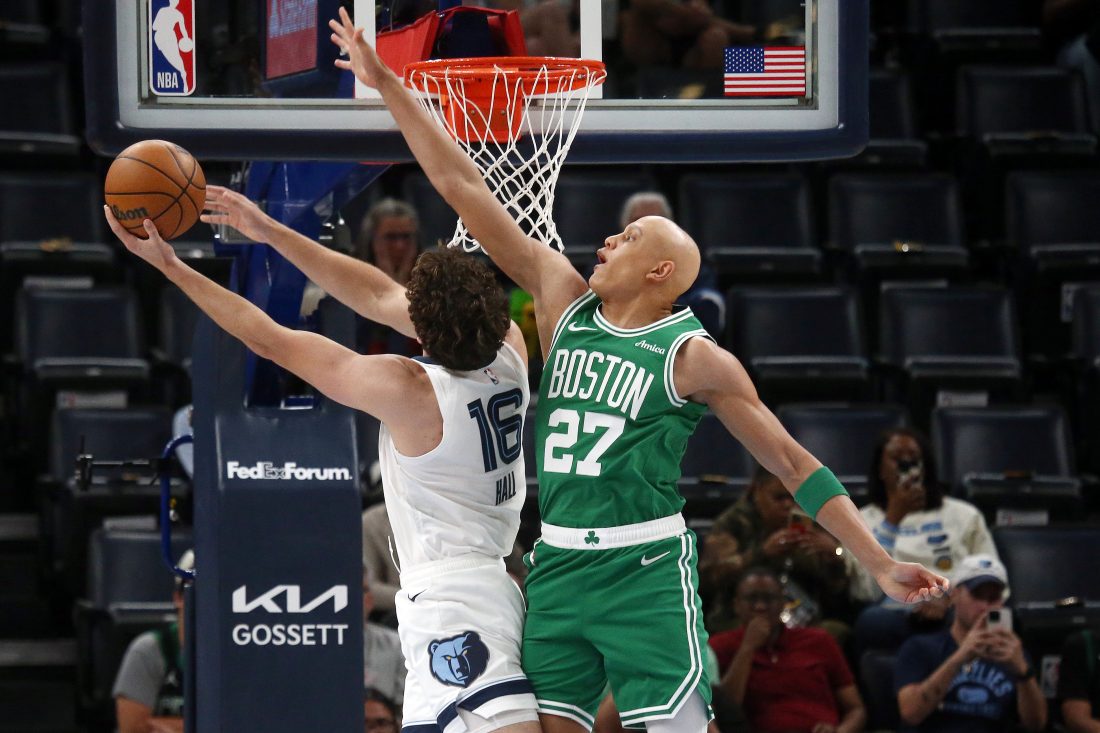 Oct 8, 2025; Memphis, Tennessee, USA; Boston Celtics guard Jordan Walsh (27) defends as Memphis Grizzlies center PJ Hall (16) shoots during the first quarter at FedExForum.