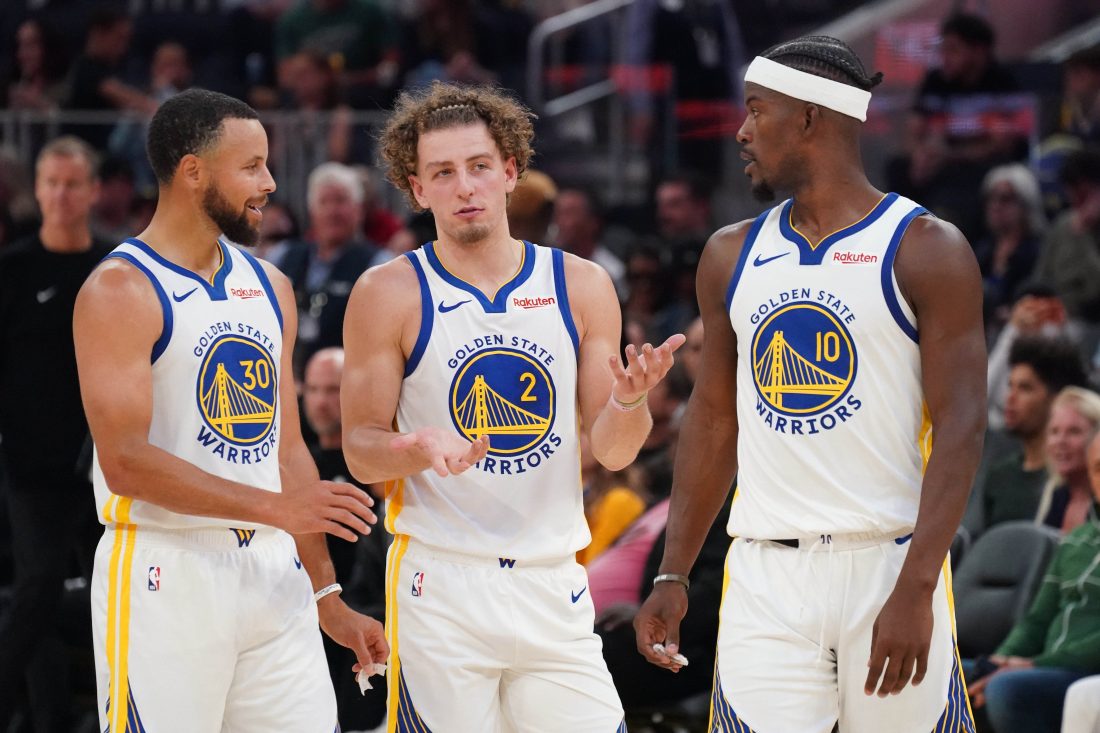 Oct 5, 2025; San Francisco, California, USA; Golden State Warriors guard Stephen Curry (30), guard Brandin Podziemski (2), and forward Jimmy Butler III (10) talk during a break in the action against the Los Angeles Lakers in the second quarter at Chase Center. Mandatory Credit: David Gonzales-Imagn Images