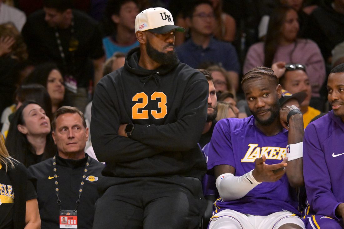 Oct 12, 2025; Los Angeles, California, USA; Los Angeles Lakers forward Lebron James (23) looks on from the bench during the first half against the Golden State Warriors at Crypto.com Arena. Mandatory Credit: Jayne Kamin-Oncea-Imagn Images