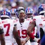 Oct 19, 2025; Denver, Colorado, USA; New York Giants quarterback Jameis Winston (19) huddles up before the game against the Denver Broncos at Empower Field at Mile High.