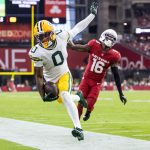 Oct 19, 2025; Glendale, Arizona, USA; Green Bay Packers wide receiver Matthew Golden (0) is pushed out of bounds by Arizona Cardinals cornerback Max Melton (16) in the second half at State Farm Stadium. Mandatory Credit: Mark J. Rebilas-Imagn Images